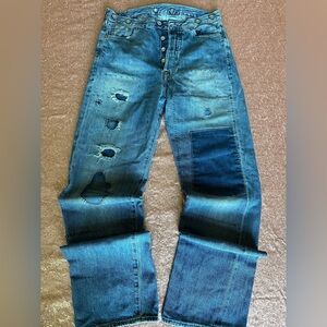 vintage Levi's 501XX, 28x31 with multiple patches, buttons and back strap, Rare